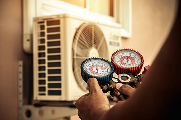 Professional Air Conditioning Service technician working in Sassamansville, PA
